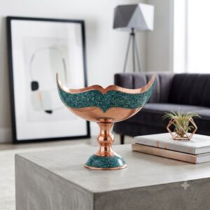 Persian turquoise inlay Kashkool serving bowl on a light concrete coffee table.