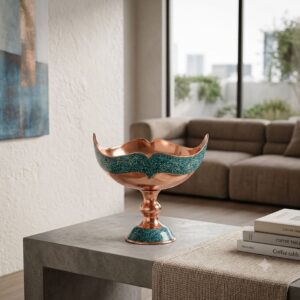 Persian turquoise inlaying Kashkool dish on a grey side table in an open-concept room.