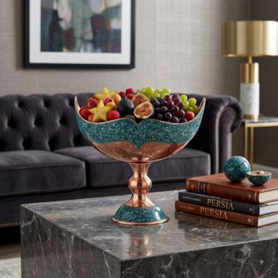 Luxury turquoise inlaying Kashkool dish filled with fresh fruit on a marble coffee table.
