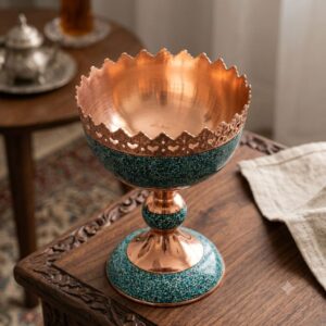 Empty turquoise inlaid copper nut bowl displaying polished copper interior and filigree crown.