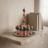 Handmade turquoise inlaying sake set with copper cups on stone shelf