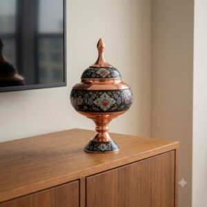 Hand-painted Copper and Pardaz candy dish standing on a modern wooden sideboard.