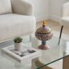 Persian enamel pottery candy dish on glass coffee table in modern living room