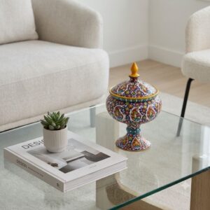 Persian enamel pottery candy dish on glass coffee table in modern living room