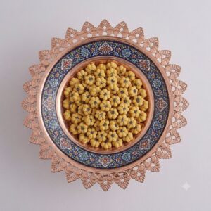 Top-down view of hand-painted pardaz floral pattern on copper platter.