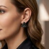 Woman wearing black geometric 3D triangle beaded earring side view