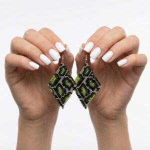 Pair of artisan hand-woven green pattern rhombus earrings held up against a clean white background.