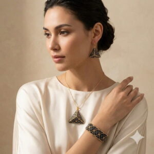 Studio shot of a model wearing the complete 3D beadwoven pyramid jewelry set.