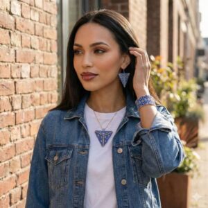 A model outdoors wearing the handmade geometric beaded jewelry set paired stylishly with a casual denim jacket.