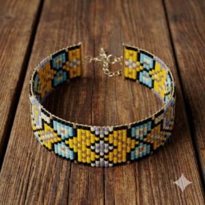 Top-down view of an adjustable hand-woven seed bead bracelet with a gold-colored extension chain on wood.